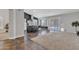 Open concept living space featuring a kitchen island, breakfast nook, and sliding glass doors at 2911 E Leland St, Mesa, AZ 85213