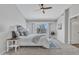 Bright main bedroom with a ceiling fan, and backyard access offering a pool view at 2911 E Leland St, Mesa, AZ 85213