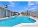 Beautiful backyard with sparkling pool, spa, patio, and gravel landscaping with privacy walls at 2911 E Leland St, Mesa, AZ 85213