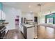 Open-concept kitchen featuring granite countertops, stainless steel appliances, and seamless living room access at 29688 W Indianola Ave, Buckeye, AZ 85396