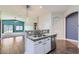 Open kitchen with granite counters, stainless appliances, and tile floor at 29688 W Indianola Ave, Buckeye, AZ 85396