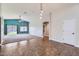 Spacious living area with tile flooring, plush carpet, modern lighting, and an open floor plan at 29688 W Indianola Ave, Buckeye, AZ 85396