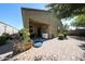 Cozy back patio with brick pavers, landscaping, and covered area, perfect for outdoor living at 30186 W Pinchot Ave, Buckeye, AZ 85396