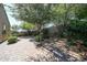 Spacious backyard with brick pavers and mature trees, creating a serene outdoor space at 30186 W Pinchot Ave, Buckeye, AZ 85396