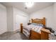 Bedroom with a wooden bed frame, nightstand, and closet at 30186 W Pinchot Ave, Buckeye, AZ 85396
