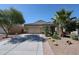 Attractive single-Gathering home with desert landscaping, a spacious driveway, and a two-car garage at 30186 W Pinchot Ave, Buckeye, AZ 85396