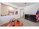 Bright living room with an open layout, decorative niches and an accent wall, next to the flatscreen television at 30186 W Pinchot Ave, Buckeye, AZ 85396