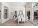 Open-concept dining area with elegant furnishings and bright lighting, seamlessly connected to other living spaces at 3146 E Maryland Ave, Phoenix, AZ 85016