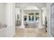 Grand foyer entrance with tile flooring, decorative columns, and views of the backyard pool at 3146 E Maryland Ave, Phoenix, AZ 85016