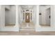 Spacious foyer features tile flooring, arched doorways, and elegant architectural details and natural light at 3146 E Maryland Ave, Phoenix, AZ 85016