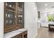 Elegant wine storage and serving area located adjacent to a modern kitchen with custom cabinets and countertops at 3146 E Maryland Ave, Phoenix, AZ 85016