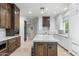 Spacious kitchen with a central island, white and wood cabinetry, and stainless steel appliances at 3146 E Maryland Ave, Phoenix, AZ 85016