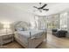 Sun-filled main bedroom offering plantation shutters, white walls, and an adjacent seating area at 3146 E Maryland Ave, Phoenix, AZ 85016