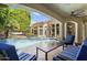 Inviting pool with lounge seating, blue tile, and nearby hammock in the backyard at 3146 E Maryland Ave, Phoenix, AZ 85016