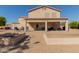 Spacious backyard with brick patio, covered seating area, and potential for customization at 31700 N Sunflower Way, San Tan Valley, AZ 85143