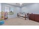 Cozy bedroom with a daybed, playful decor, and ample natural light, creating a comfortable and inviting space at 31700 N Sunflower Way, San Tan Valley, AZ 85143