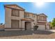 Inviting two-story home featuring neutral stucco and a two-car garage at 31700 N Sunflower Way, San Tan Valley, AZ 85143