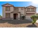 Charming two-story home with a two-car garage and gravel landscaping at 31700 N Sunflower Way, San Tan Valley, AZ 85143