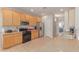 Well-equipped kitchen features wooden cabinets, stainless steel appliances, and ample counter space at 31700 N Sunflower Way, San Tan Valley, AZ 85143