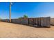 Large backyard with a block wall, a gate, and a gravel surface, perfect for creating your dream outdoor space at 38106 N 2Nd Ln, Phoenix, AZ 85086