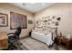 Bedroom with accent wall decorations, shutters, desk, and a plush daybed at 38106 N 2Nd Ln, Phoenix, AZ 85086