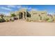 Beautiful home exterior with desert landscaping, featuring native plants and thoughtful design at 38106 N 2Nd Ln, Phoenix, AZ 85086