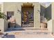 Inviting front entry gate with custom tree and raven design at 38106 N 2Nd Ln, Phoenix, AZ 85086