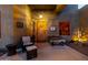 Inviting front porch featuring a cozy seating area and a decorative welcome sign at 38106 N 2Nd Ln, Phoenix, AZ 85086