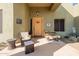 Covered front porch with welcome sign, wooden bench, and cozy seating at 38106 N 2Nd Ln, Phoenix, AZ 85086