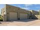 Oversized two-car garage with ample parking space, featuring exterior lighting and convenient access at 38106 N 2Nd Ln, Phoenix, AZ 85086