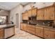 Kitchen featuring granite counter tops, wood cabinetry, and stainless steel appliances at 38106 N 2Nd Ln, Phoenix, AZ 85086
