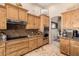 Kitchen with granite counter tops, knotty alder cabinets and stainless steel appliances at 38106 N 2Nd Ln, Phoenix, AZ 85086