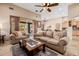 Comfortable living room with ceiling fan and sliding glass doors to the backyard at 38106 N 2Nd Ln, Phoenix, AZ 85086
