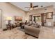 Cozy living room with comfortable seating, ceiling fan and views of the backyard at 38106 N 2Nd Ln, Phoenix, AZ 85086