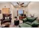 Inviting office with beamed ceiling, tile floors, and leather furnishings at 38106 N 2Nd Ln, Phoenix, AZ 85086