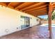 Charming covered back patio featuring brick flooring and a sliding glass door entrance to the home at 3913 N 86Th St, Scottsdale, AZ 85251