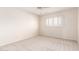 Bedroom featuring neutral carpet and a window with shutter blinds at 3913 N 86Th St, Scottsdale, AZ 85251