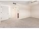 Bright bedroom featuring neutral carpeting, a ceiling fan, and ensuite bathroom access at 3913 N 86Th St, Scottsdale, AZ 85251