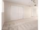 Bright bedroom featuring neutral carpeting, a ceiling fan, and closet doors at 3913 N 86Th St, Scottsdale, AZ 85251