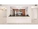 Bright kitchen featuring wood cabinetry, stainless appliances, and a breakfast bar at 3913 N 86Th St, Scottsdale, AZ 85251