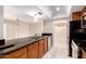 Contemporary kitchen with stainless steel appliances, granite counters, and wood cabinets at 3913 N 86Th St, Scottsdale, AZ 85251