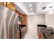 Functional kitchen featuring stainless steel appliances and dark countertops and ample cabinet space at 3913 N 86Th St, Scottsdale, AZ 85251