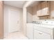 Functional laundry area with modern appliances and storage cabinets at 3913 N 86Th St, Scottsdale, AZ 85251