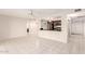 Spacious living room with tile flooring, a breakfast bar, and an open layout for easy entertaining at 3913 N 86Th St, Scottsdale, AZ 85251