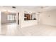 Open-concept living space with tile flooring, a breakfast bar, and easy access to the kitchen and dining area at 3913 N 86Th St, Scottsdale, AZ 85251