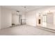 Bright living room with neutral paint and flooring, leading to the kitchen, entryway and backyard at 3913 N 86Th St, Scottsdale, AZ 85251