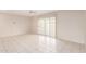 Large living room with bright tile floors and sliding glass doors allowing for natural light at 3913 N 86Th St, Scottsdale, AZ 85251