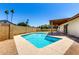 Backyard view showcasing the sparkling swimming pool, patio area, and well-maintained perimeter block fence at 3913 N 86Th St, Scottsdale, AZ 85251