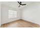 Well-lit bedroom with wood floors, a neutral palette, and a contemporary ceiling fan at 3955 W Cindy St, Chandler, AZ 85226