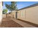 The exterior shows a walkway leading to a front door of a stucco house with a rock landscape at 3955 W Cindy St, Chandler, AZ 85226